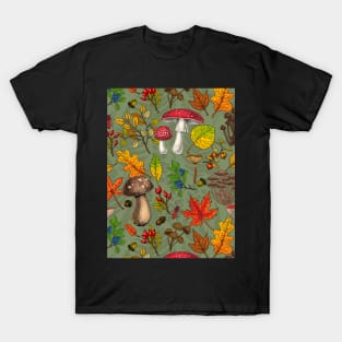 Autumn mushrooms, leaves, nuts and berries on green T-Shirt